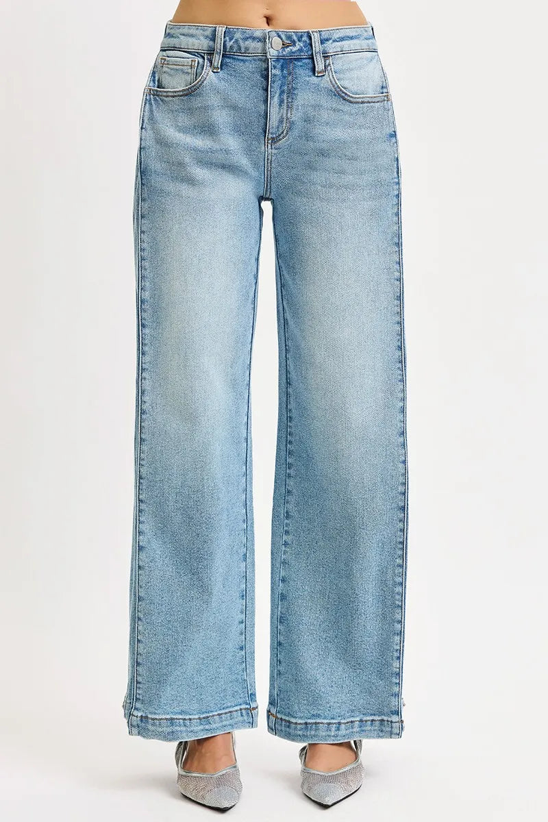 Model wearing RISEN Mid Rise Wide Barrel Transferable Leg Snap Jeans showcasing mid rise waist and modern wide barrel silhouette