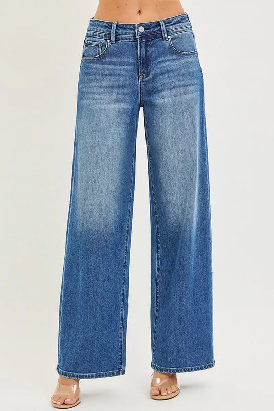 Model standing straight on in loose fit baggy jeans with pockets, no stretch denim, relaxed through hip and thigh, 31.5 inch inseam