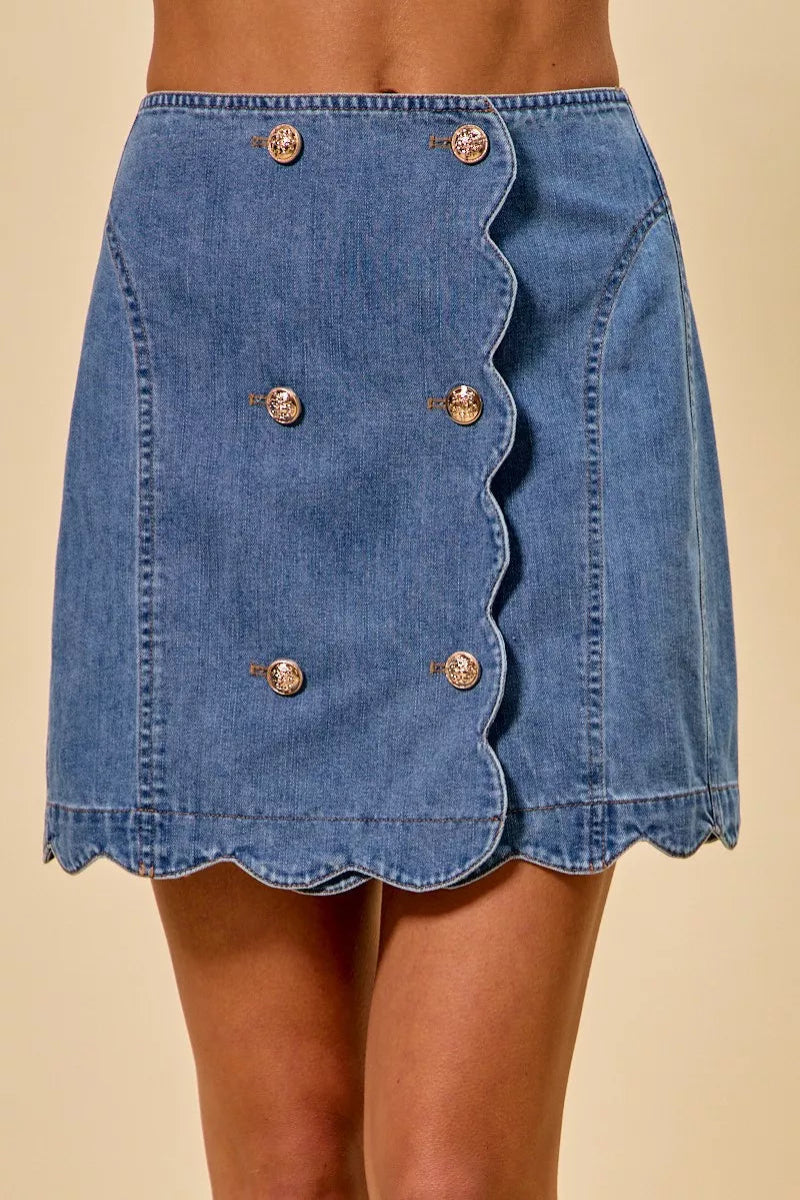SO ME denim scalloped button front mini skirt for women model standing facing front, showing scalloped hem, button front closure, denim fabric, mini length