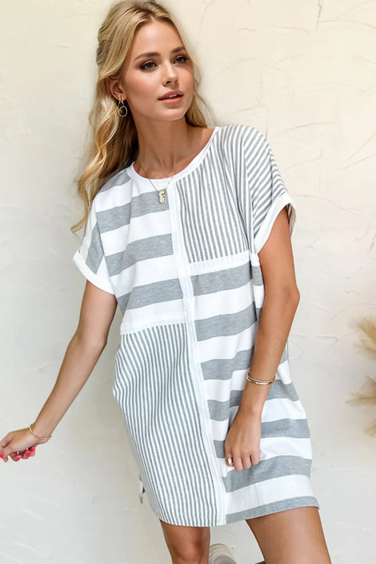 Side view of striped mini tee dress showing relaxed A-line silhouette and comfortable short sleeve length