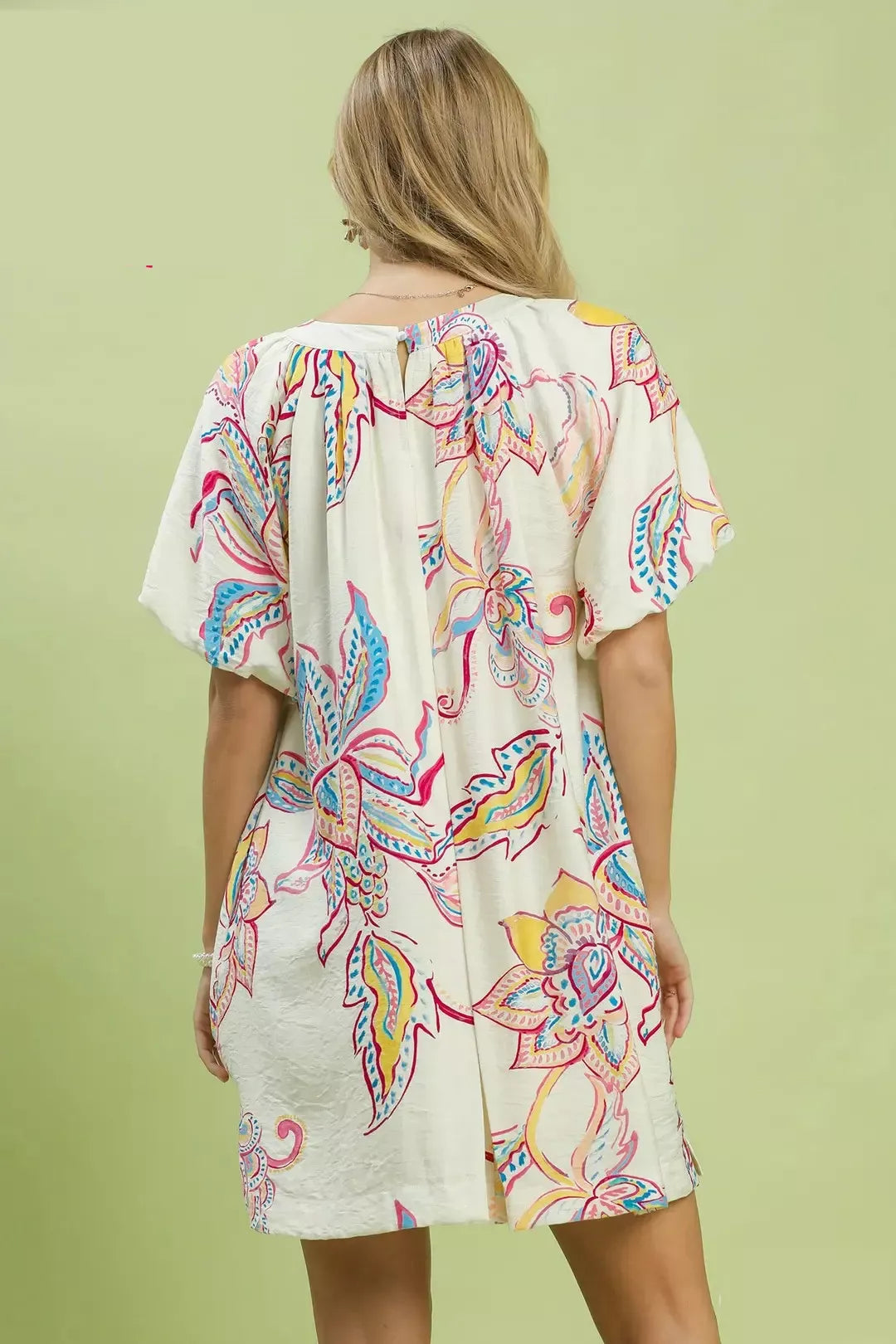 Back view of Umgee boho floral mini dress. Open scoop back or button closure (adjust based on actual dress). Floral print continues evenly. Loose breathable fit. Summer dress with pockets.

