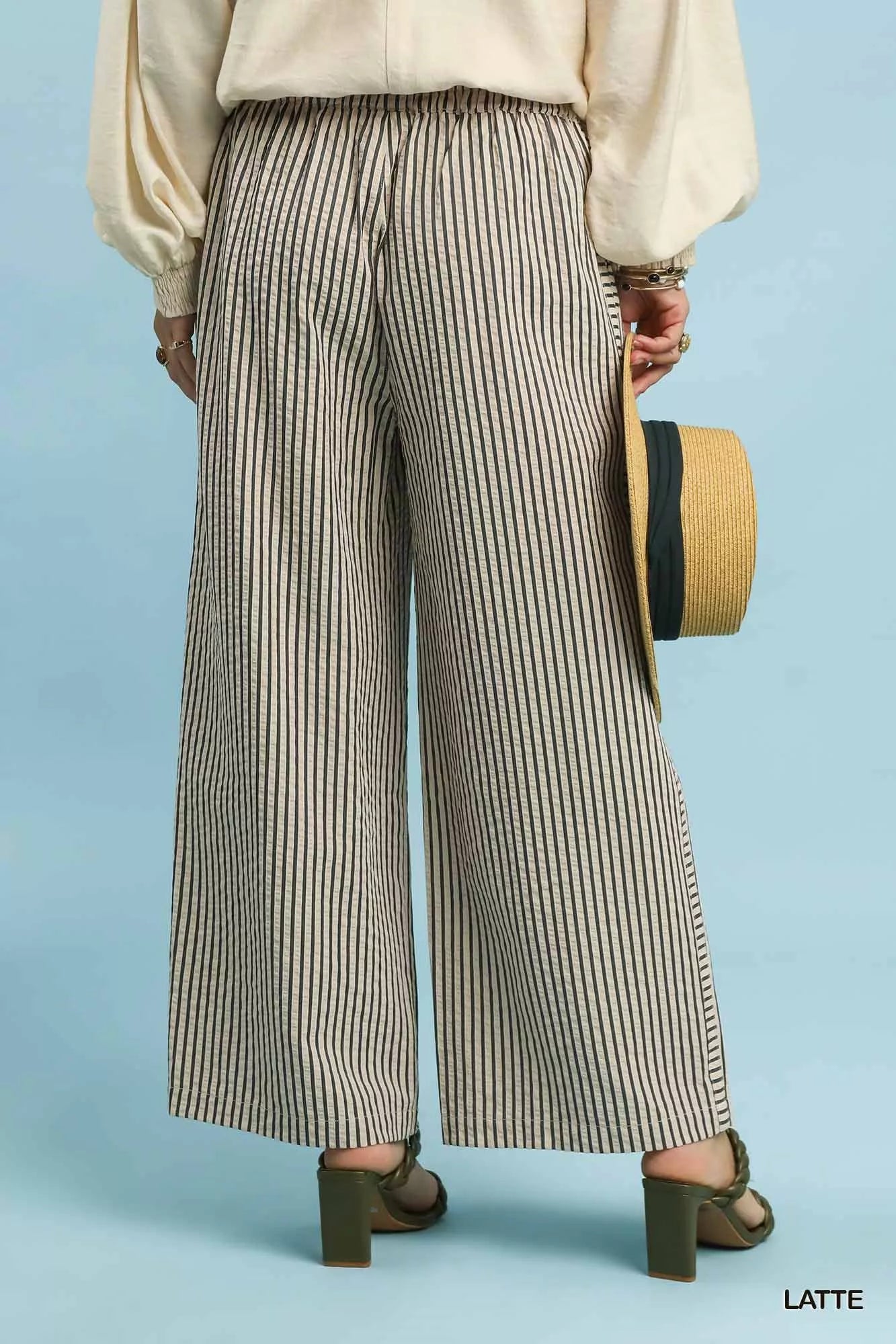 Back view of Umgee drawstring striped wide-leg pants, showing the wide-leg silhouette and back detailing.
