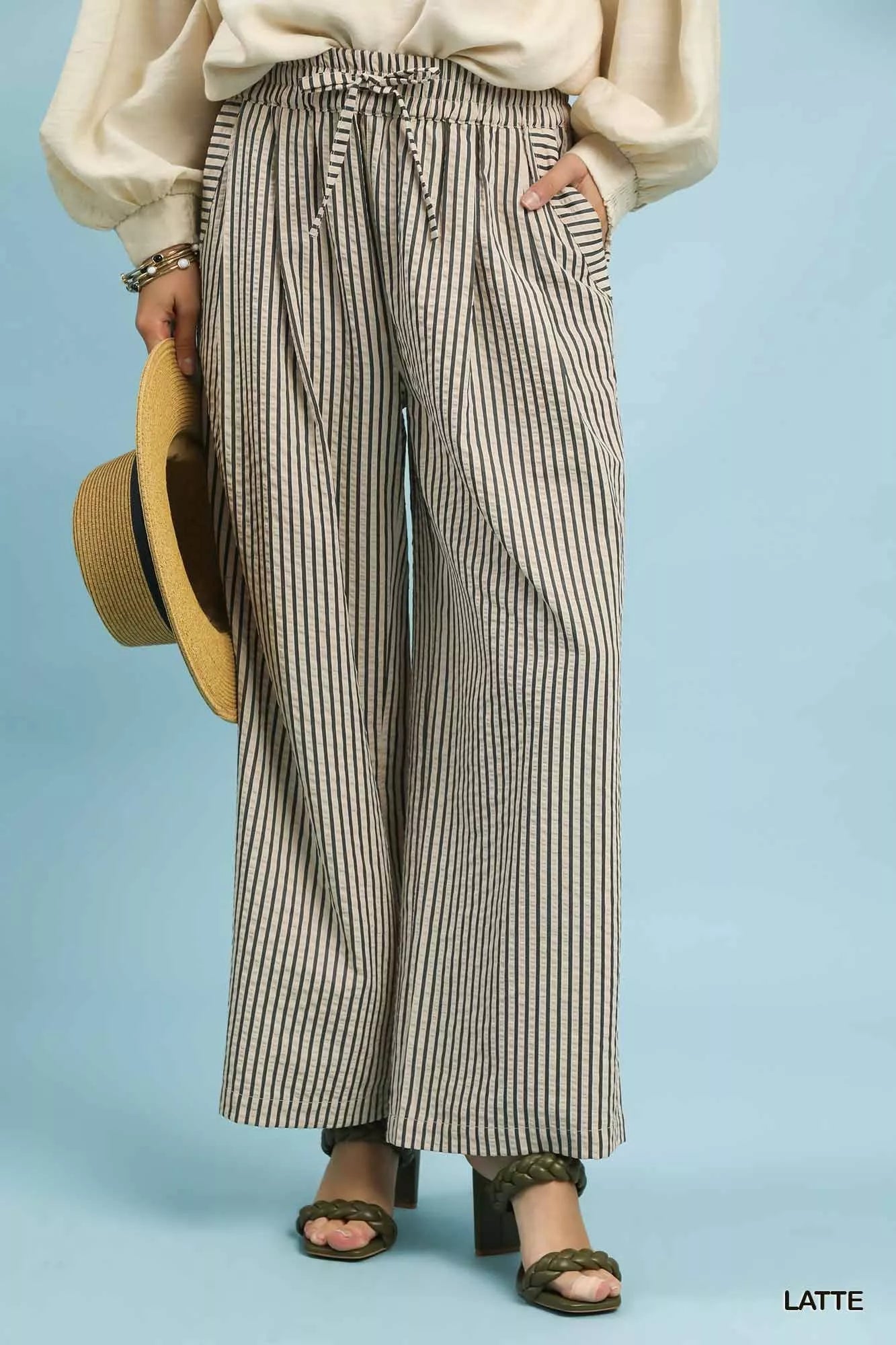Front view of Umgee drawstring striped wide-leg pants, showing the relaxed fit, vertical stripes, and adjustable drawstring waist.
