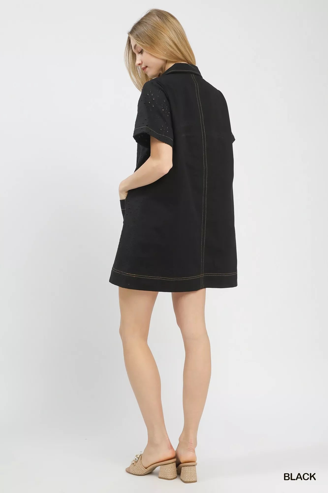 Back closeup of the Umgee eyelet short sleeve shift dress, focusing on the eyelet pattern and back seam detail.
