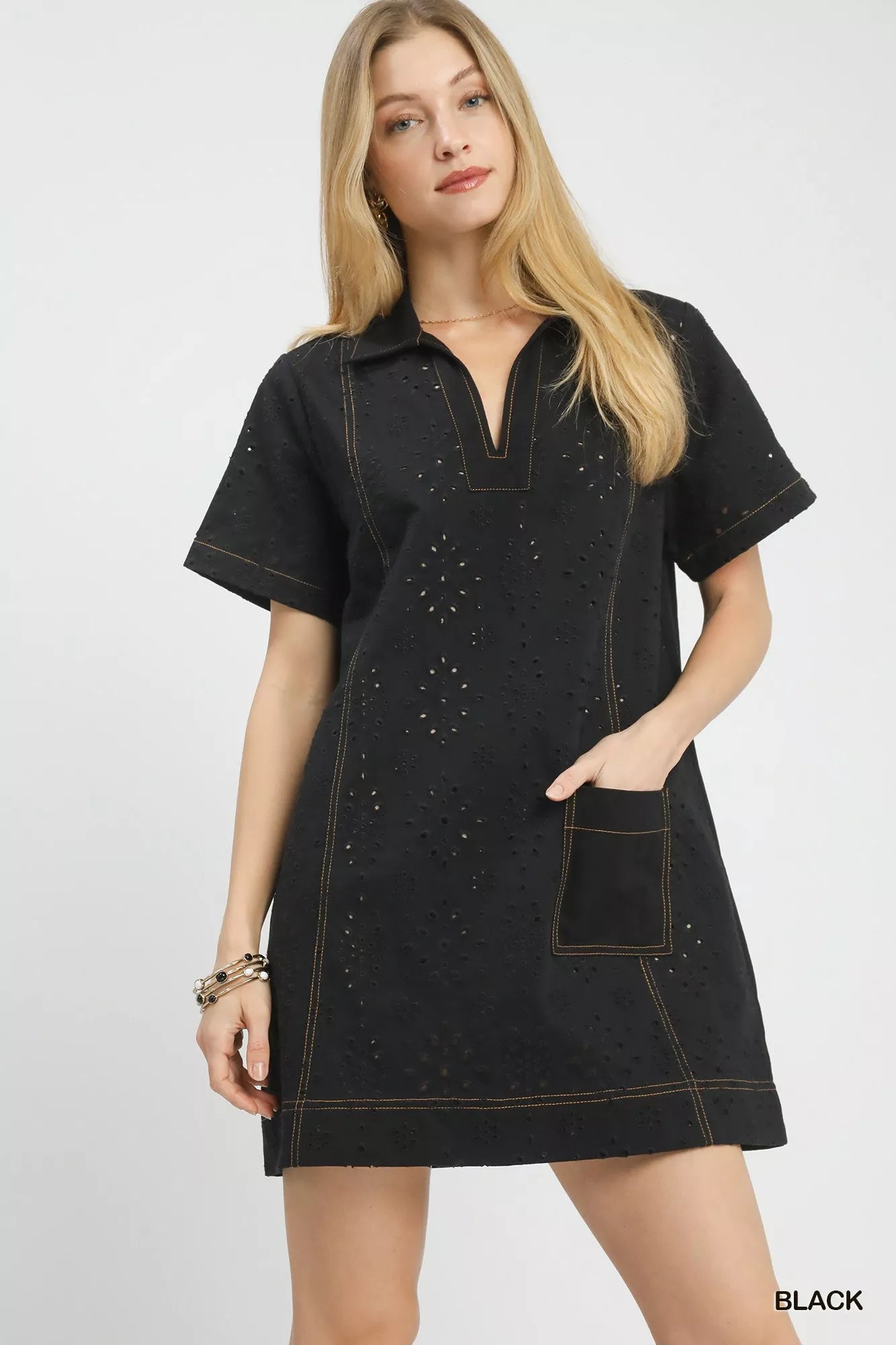 Front view of the Umgee eyelet short sleeve shift dress with pocket, showing the relaxed shift fit and delicate eyelet fabric.
