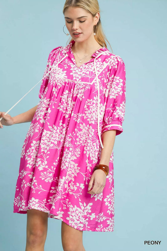 Front view of Umgee floral babydoll dress with pockets showing flowy fit and floral pattern
