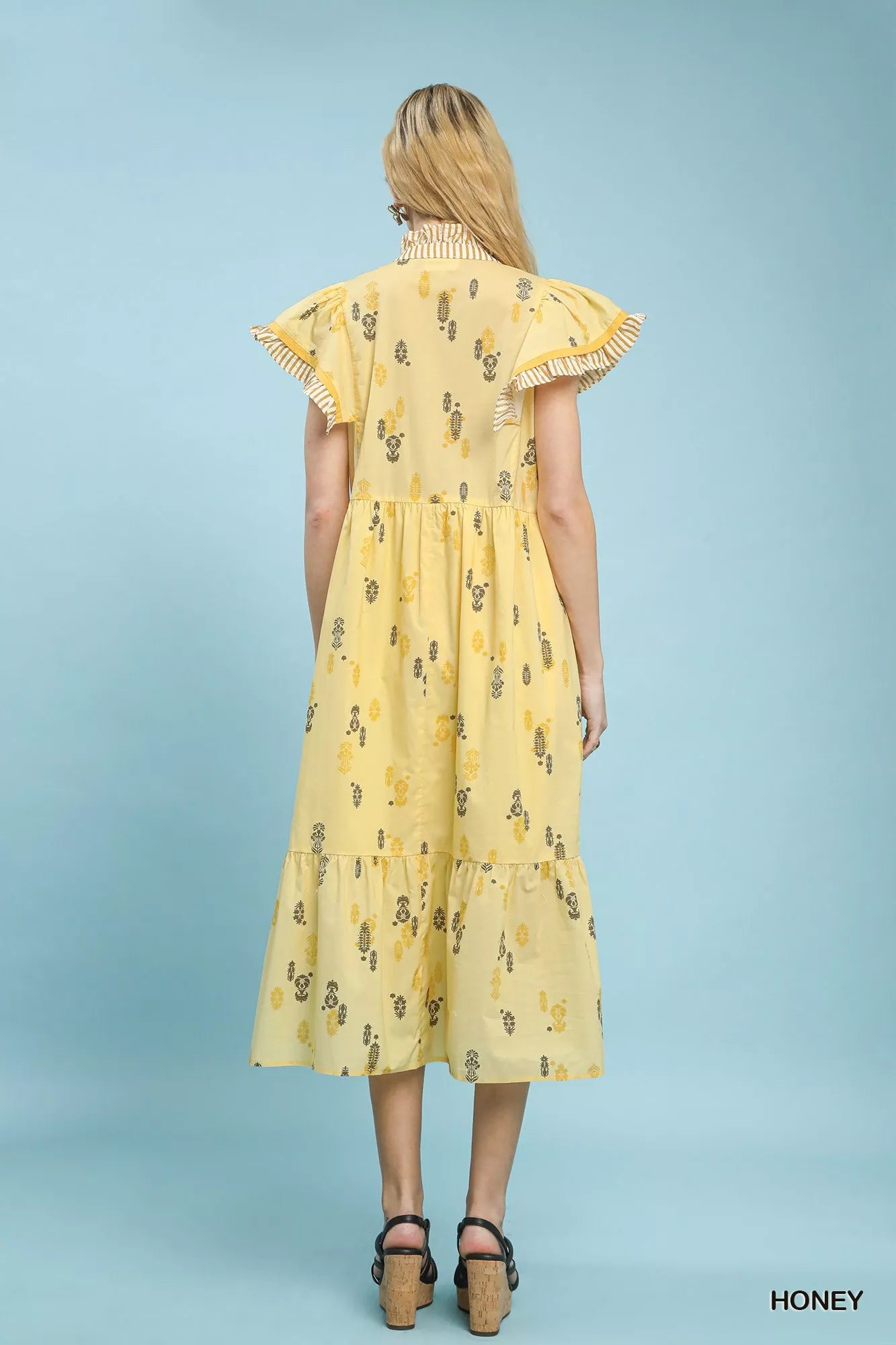 Back view of Umgee floral ruffle sleeve tiered midi dress showing tiered hemline
