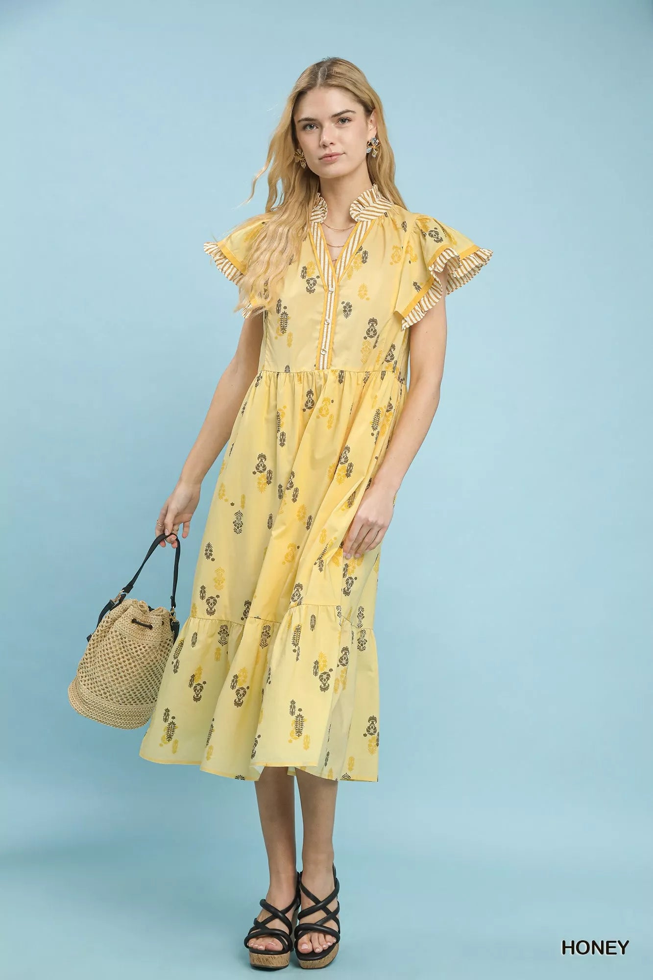 Close-up front view of Umgee floral tiered midi dress showing ruffle sleeves and floral print
