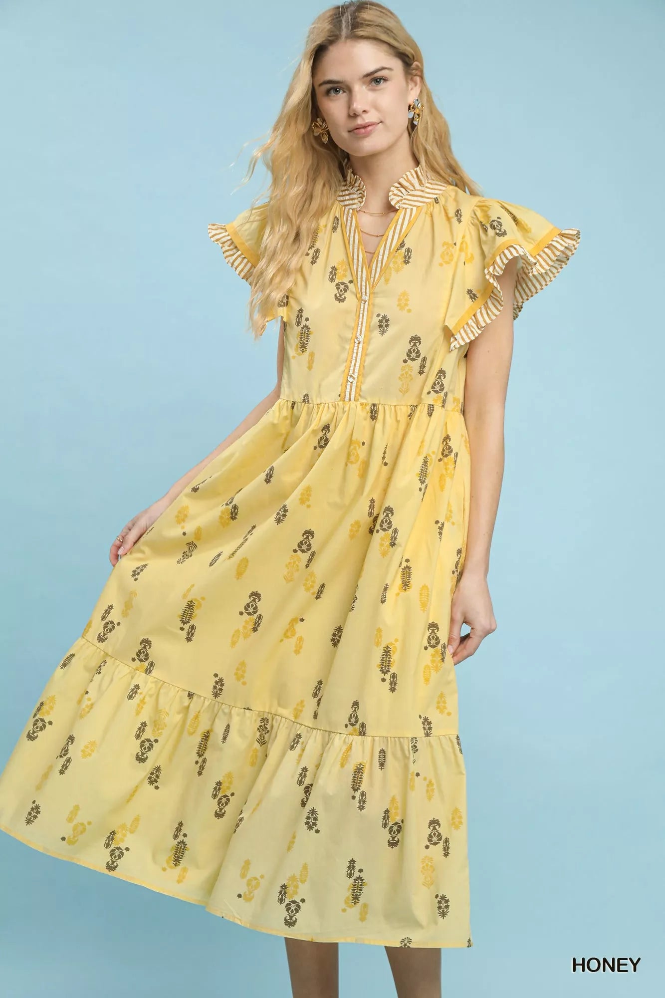 Front view of Umgee floral ruffle sleeve tiered midi dress in butter yellow on model
