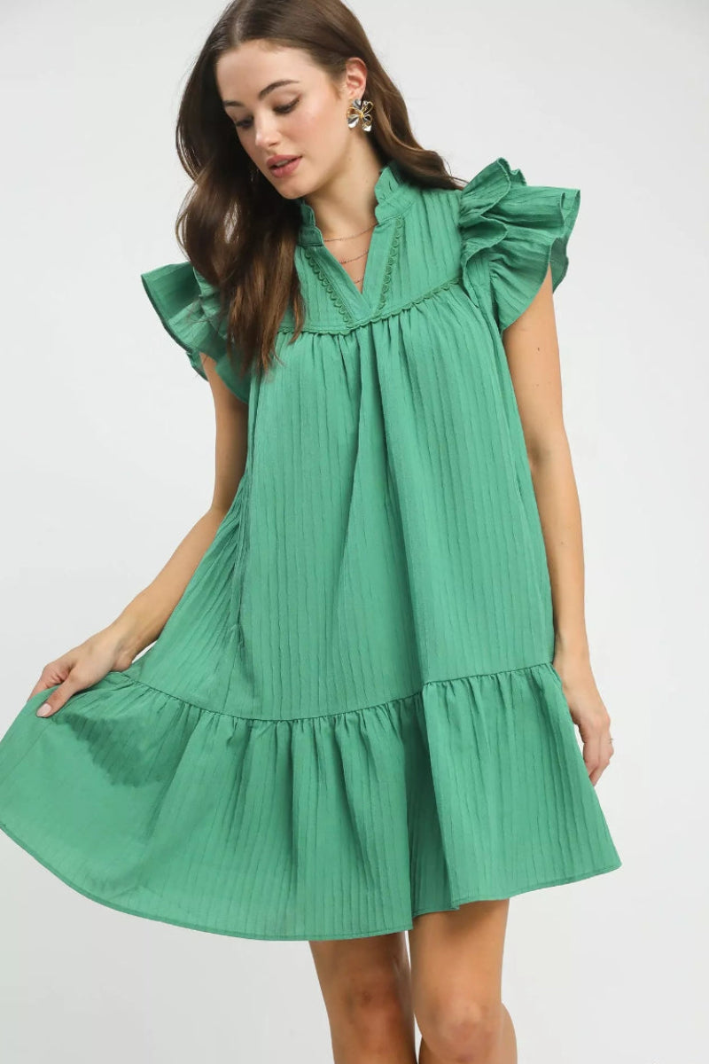 Front view of Umgee flutter sleeve tiered dress showing flowy silhouette and feminine boutique style.