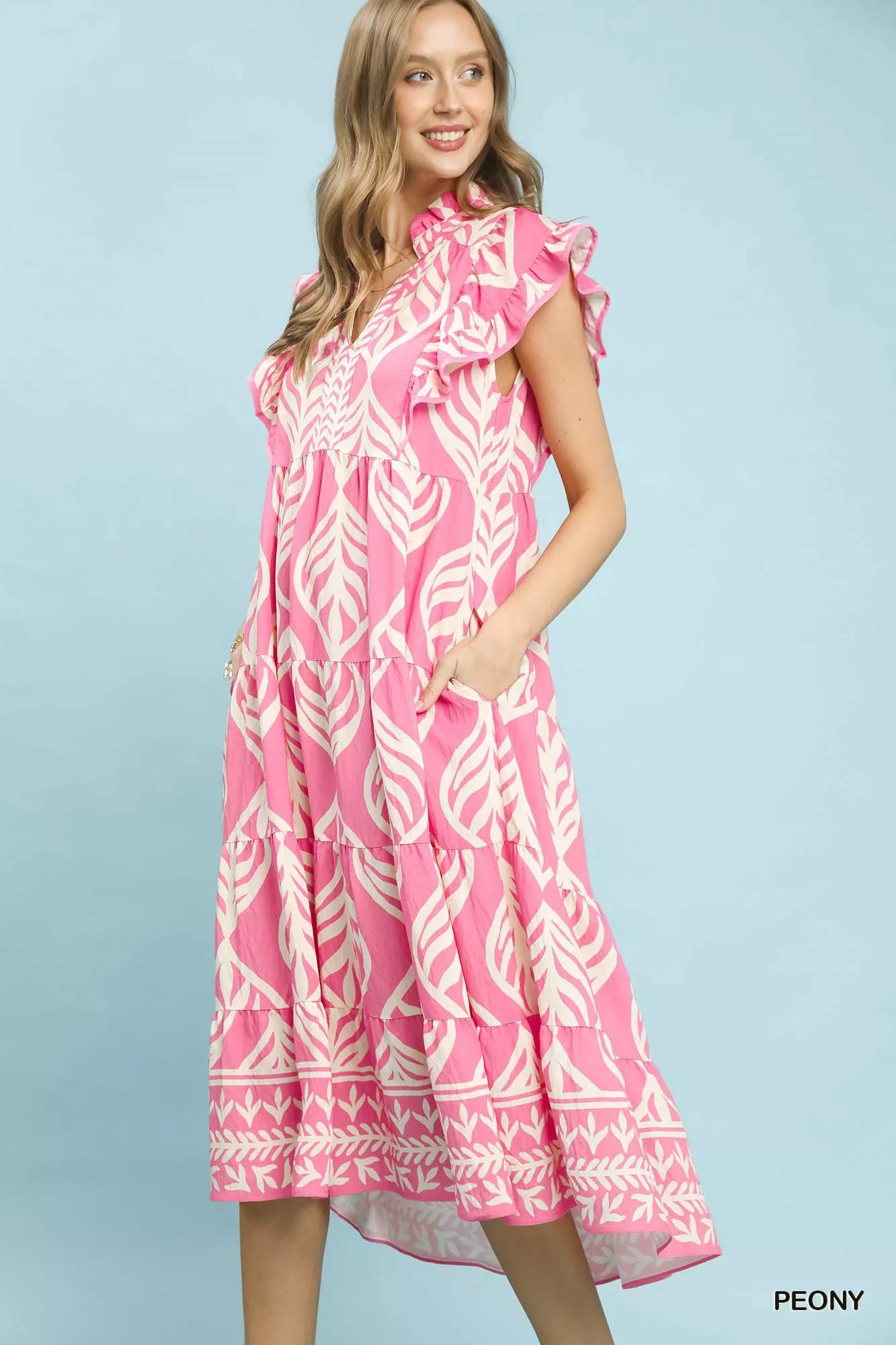 Side view of Umgee Leaf Print Tiered Maxi Dress with Pockets highlighting flowy silhouette and comfortable fit