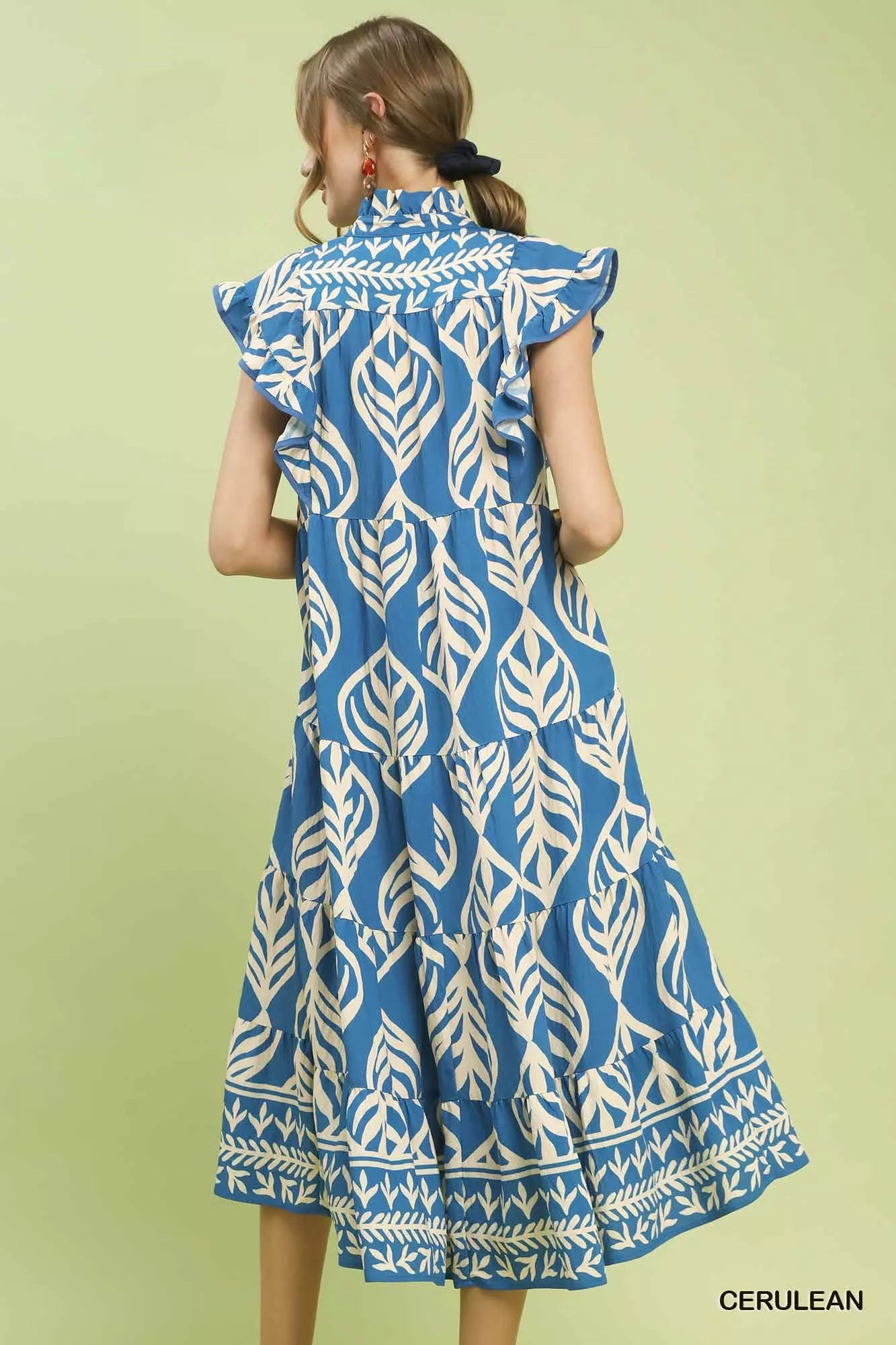 Back view of Umgee Leaf Print Tiered Midi Dress with Pockets showing tiered layers and relaxed flowy fit.