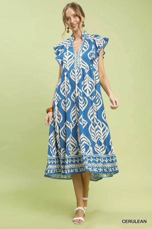 Front view of Umgee Leaf Print Tiered Midi Dress with Pockets showing flowy tiered design and relaxed fit.
