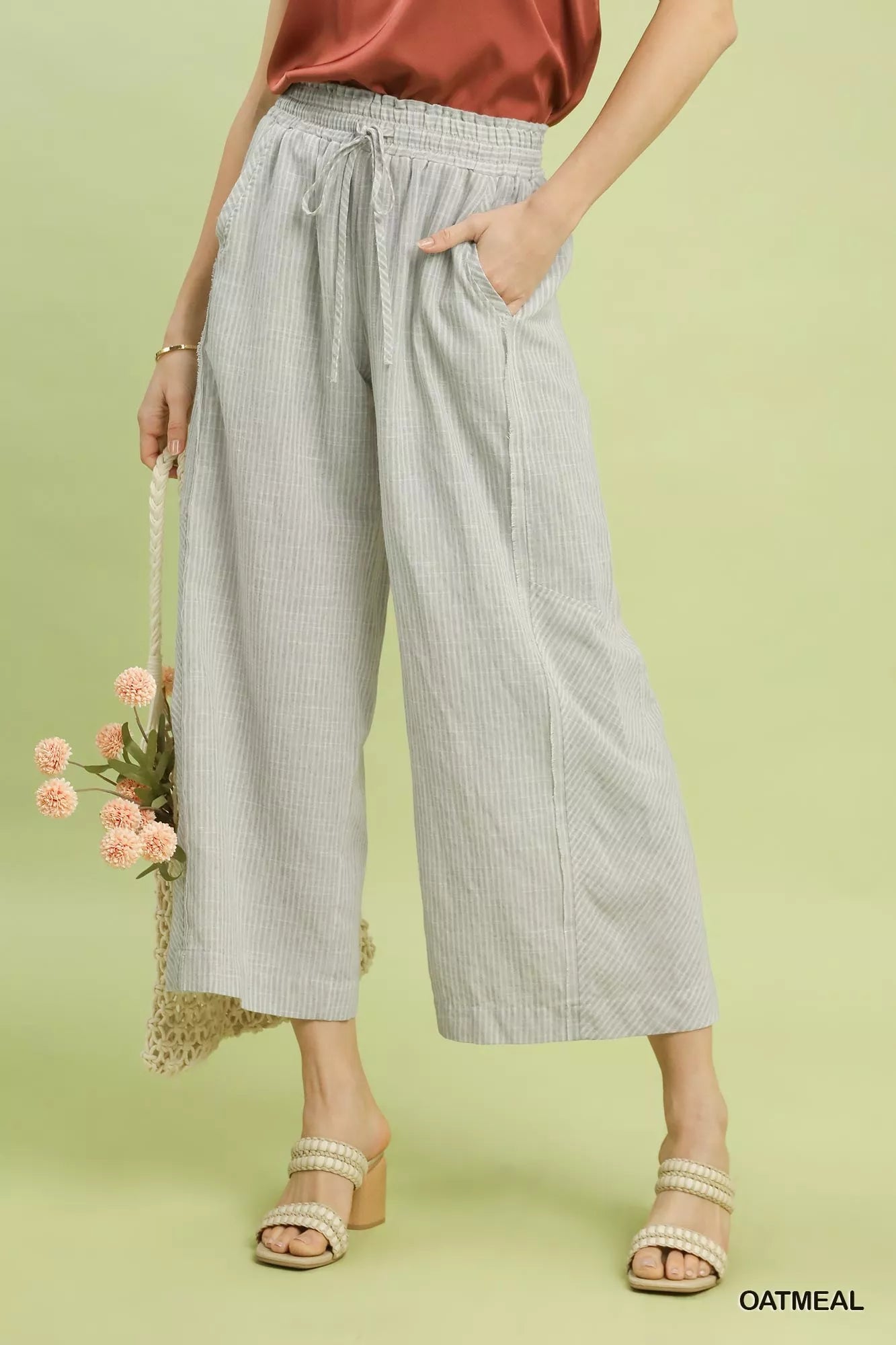 Umgee linen blend striped wide leg pants front view on model.
