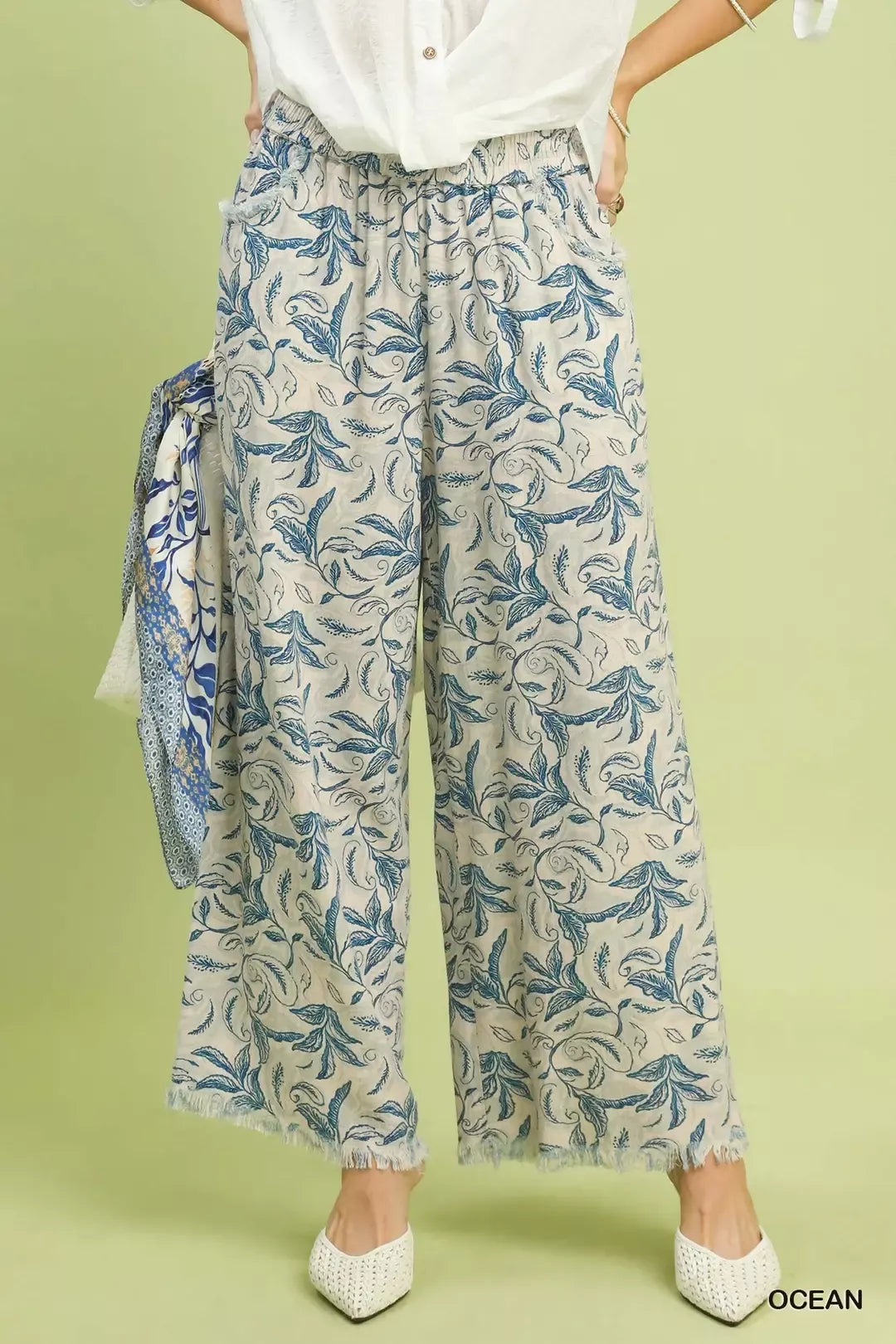 Front view of Umgee Linen Printed Wide Leg Raw Hem Pants on model showing relaxed fit and breathable linen fabric.
