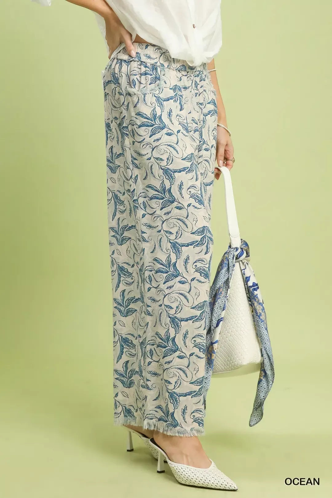 Side view of Umgee Linen Printed Wide Leg Raw Hem Pants showing flowing wide leg, relaxed fit, and breezy linen fabric.