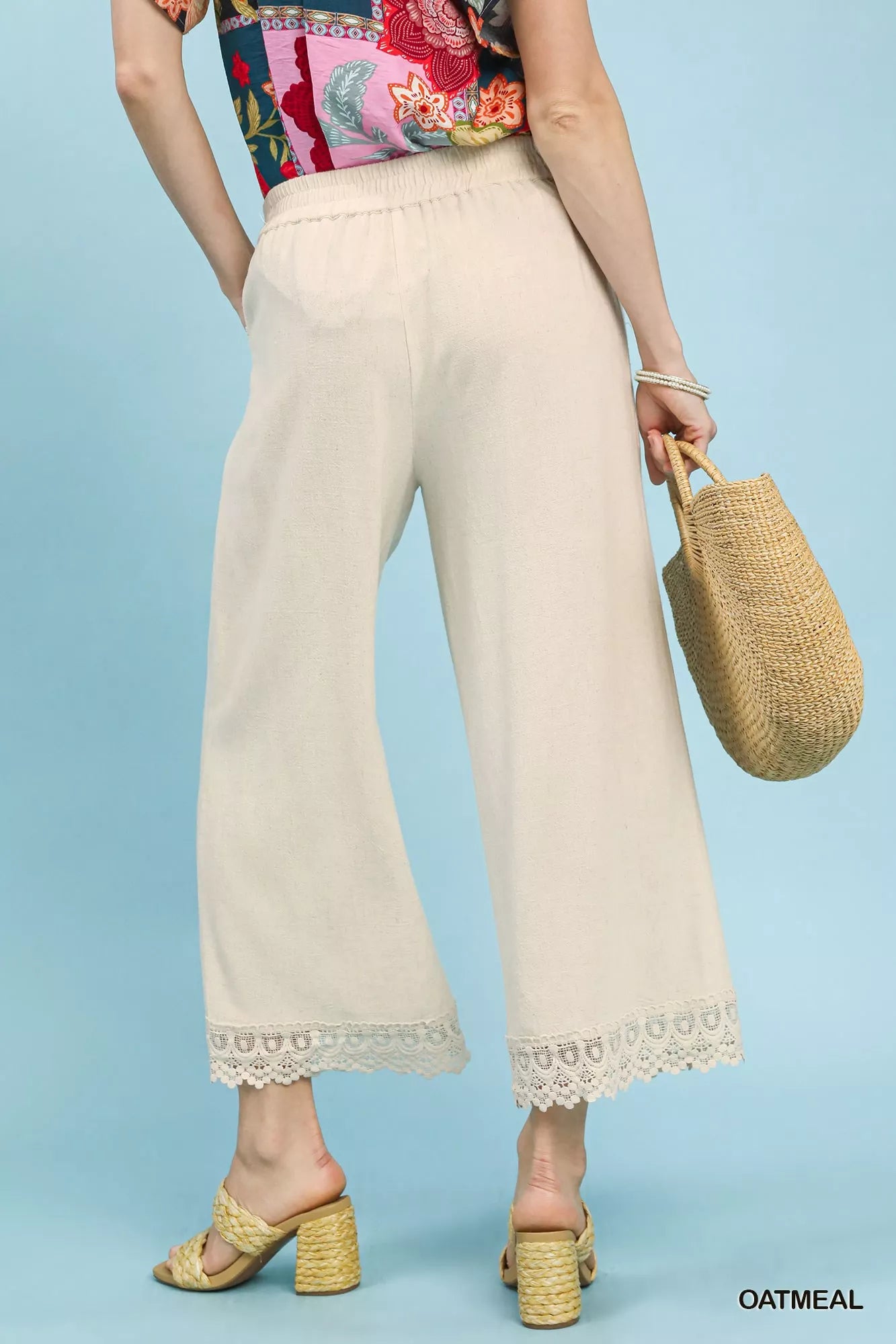 Back view of Umgee linen wide leg cropped pants with lace trim highlighting relaxed fit and clean linen finish
