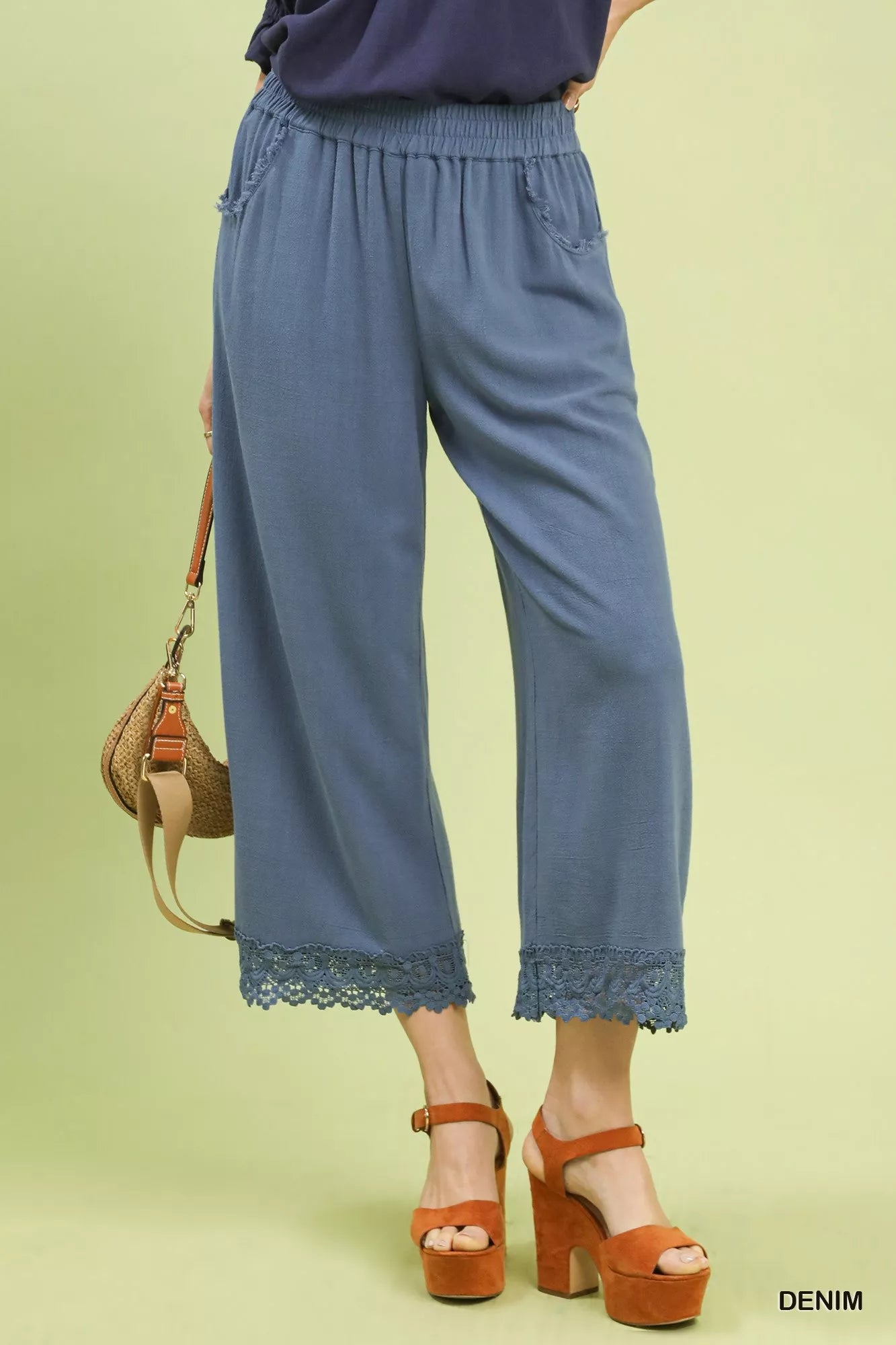 Front view of Umgee linen wide leg cropped pants with lace trim on model
