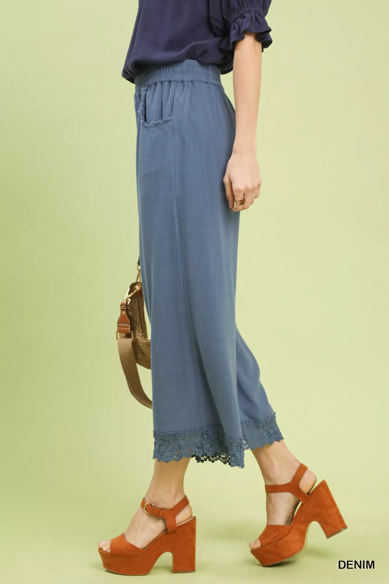Side view of Umgee linen wide leg cropped pants with lace trim and wide leg fit
