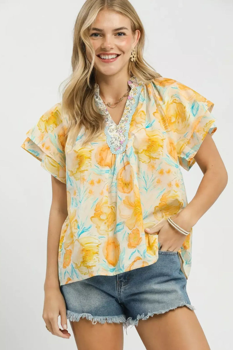 Umgee Mixed Floral Blouse with Crochet Lace Trim front view - boho flutter sleeve top with mixed floral print, crochet lace trim at neckline or hem, and relaxed romantic fit

