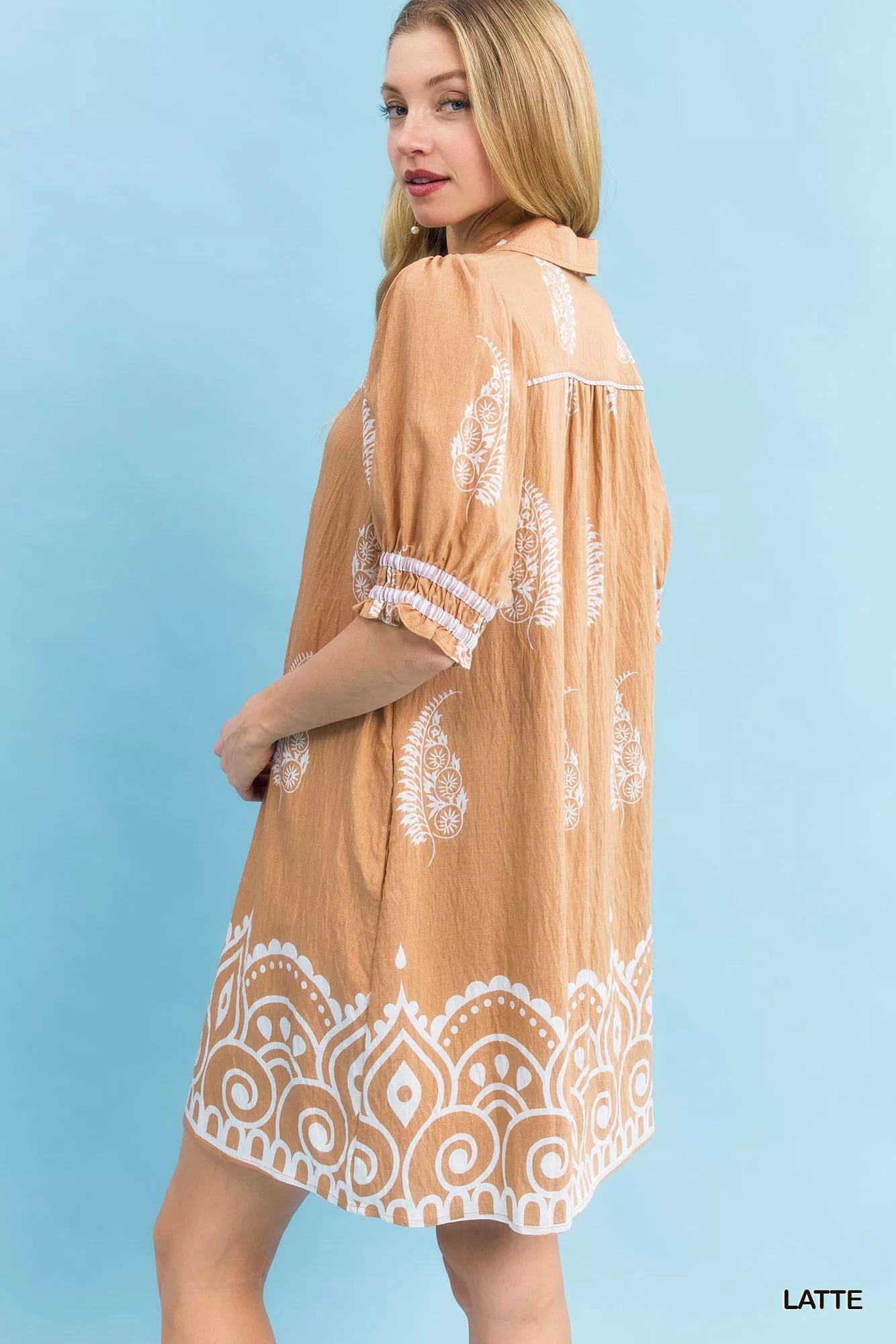 Back view of Umgee paisley mandala print babydoll dress showing print and hemline.
