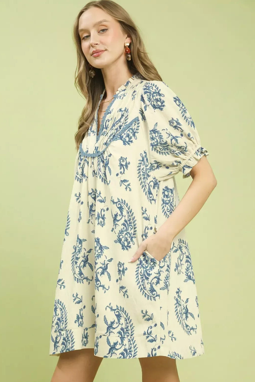 Umgee Paisley Print Scallop Trim Dress side view - lightweight mini dress with side drape, paisley print continuing along seam, lace accents and scallop hem visible from side

