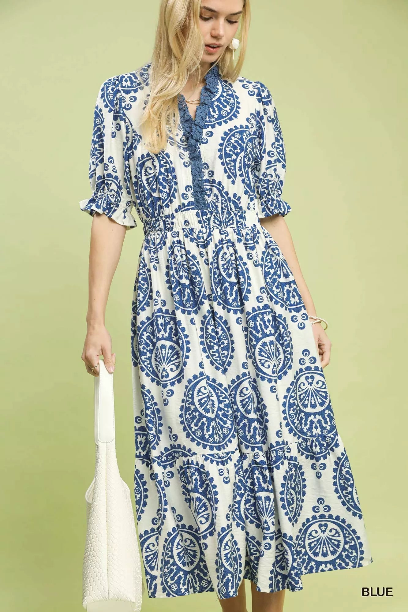Model wearing Umgee paisley smocked waist midi dress, front view showing flowy boho fit and elastic waist
