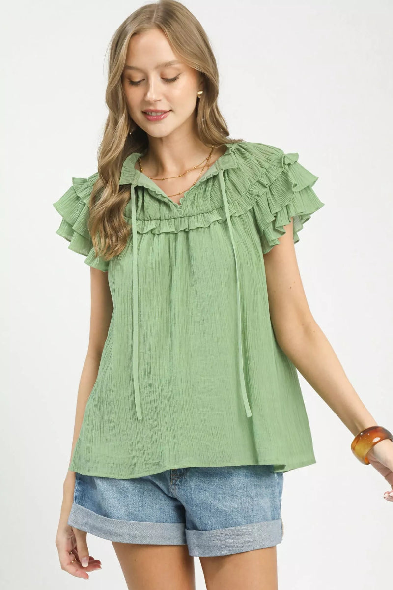 Umgee ruffled flutter sleeve blouse front view with textured fabric and tie detail, romantic women’s top with soft feminine style