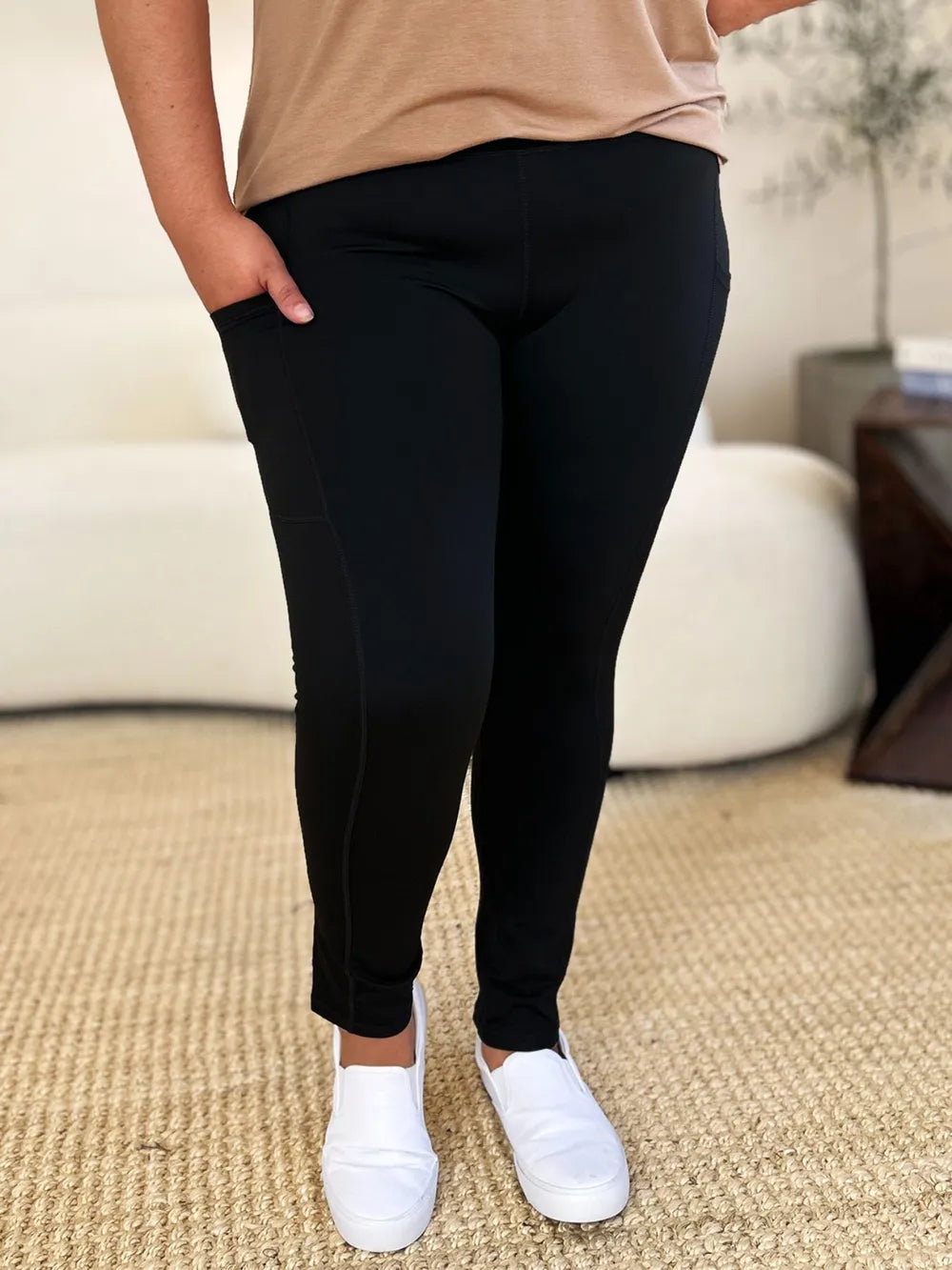 Model facing forward in buttery soft wide waistband leggings, full length squat proof fit, flat stomach silhouette, neutral studio lighting