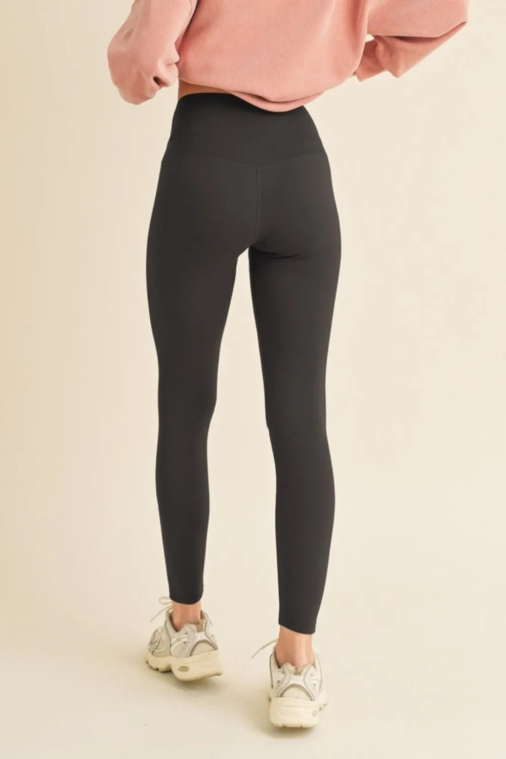 Back view of Yelete full size fleece lined leggings showing sculpting fit and comfortable stretch fabric.