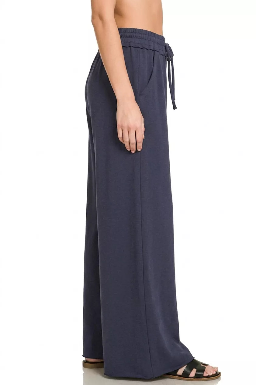 Zenana French Terry wide leg sweatpants for women model standing facing back, back view of wide leg sweatpants, showing elastic waistband and relaxed silhouette from behind