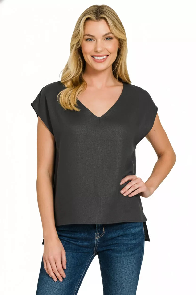 Model wearing Zenana Linen V-Neck Sleeveless Top highlighting chic sleeveless design and flowy lightweight style