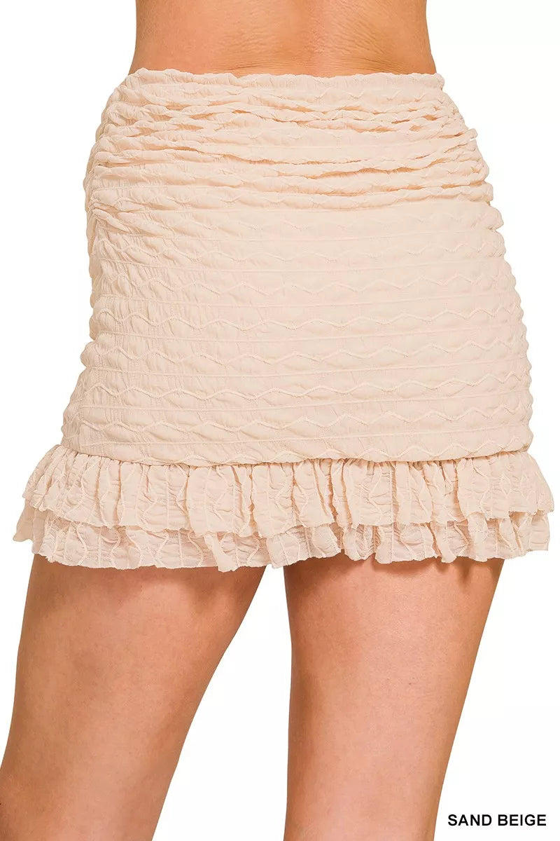 Back view of Zenana Ruched Mini Skirt with built-in shorts showing smooth fit and flattering rear silhouette.