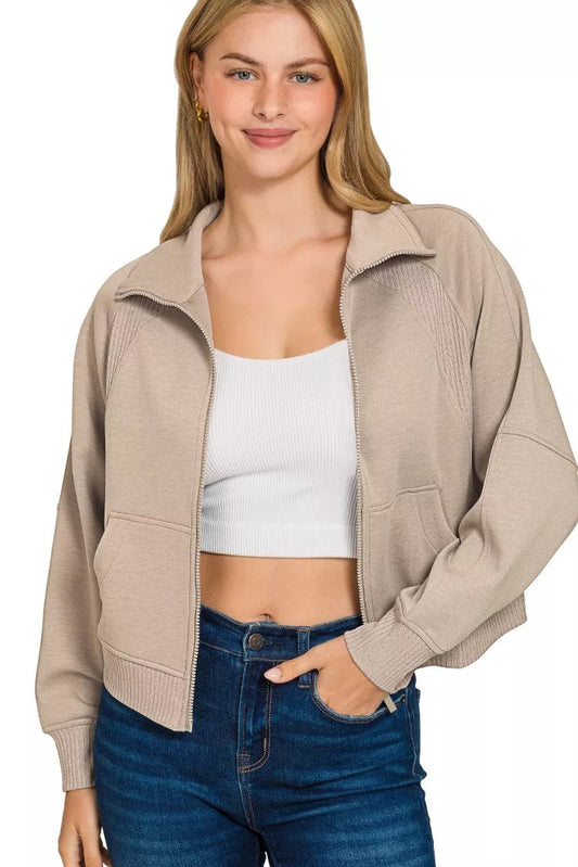 Front view of Zenana cropped scuba jacket with model's hand in pockets demonstrating functional pocket placement and relaxed fit.