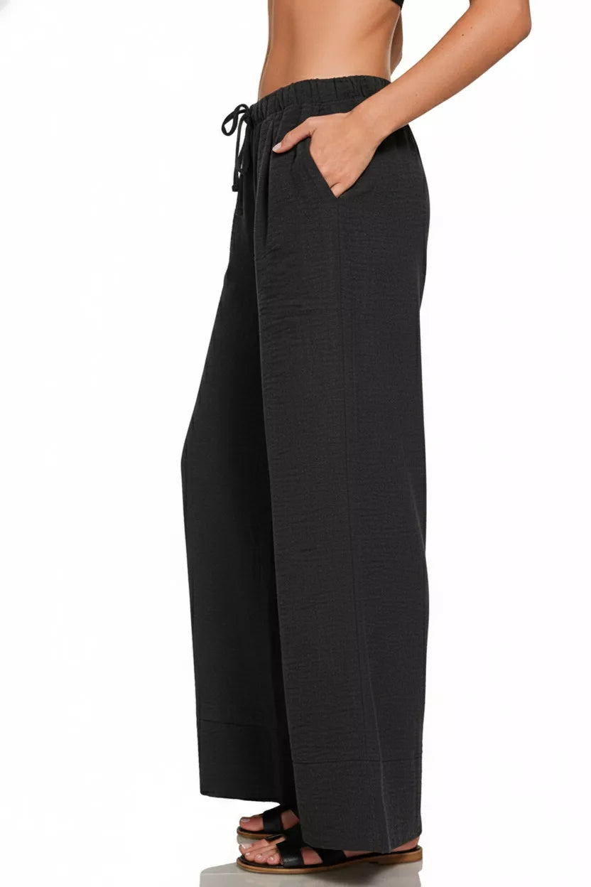 Side view of Zenana Woven Airflow Drawstring Pants highlighting relaxed silhouette and breathable summer fabric